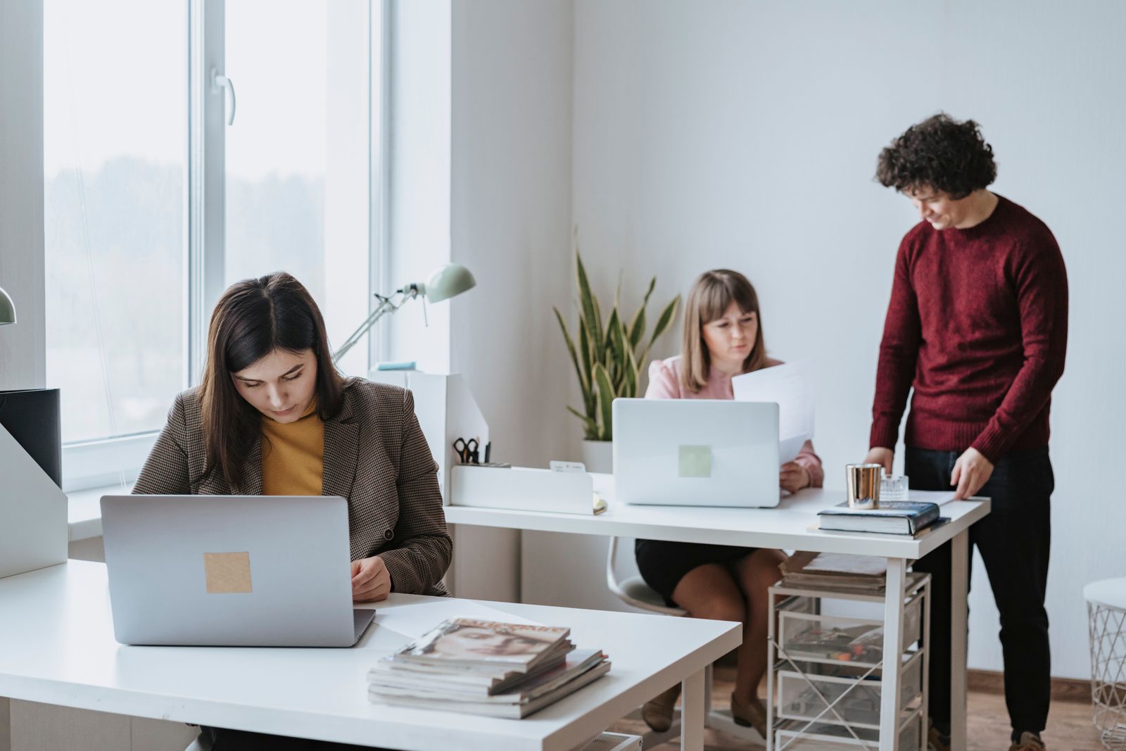Loan officers working together at the Magnolia office