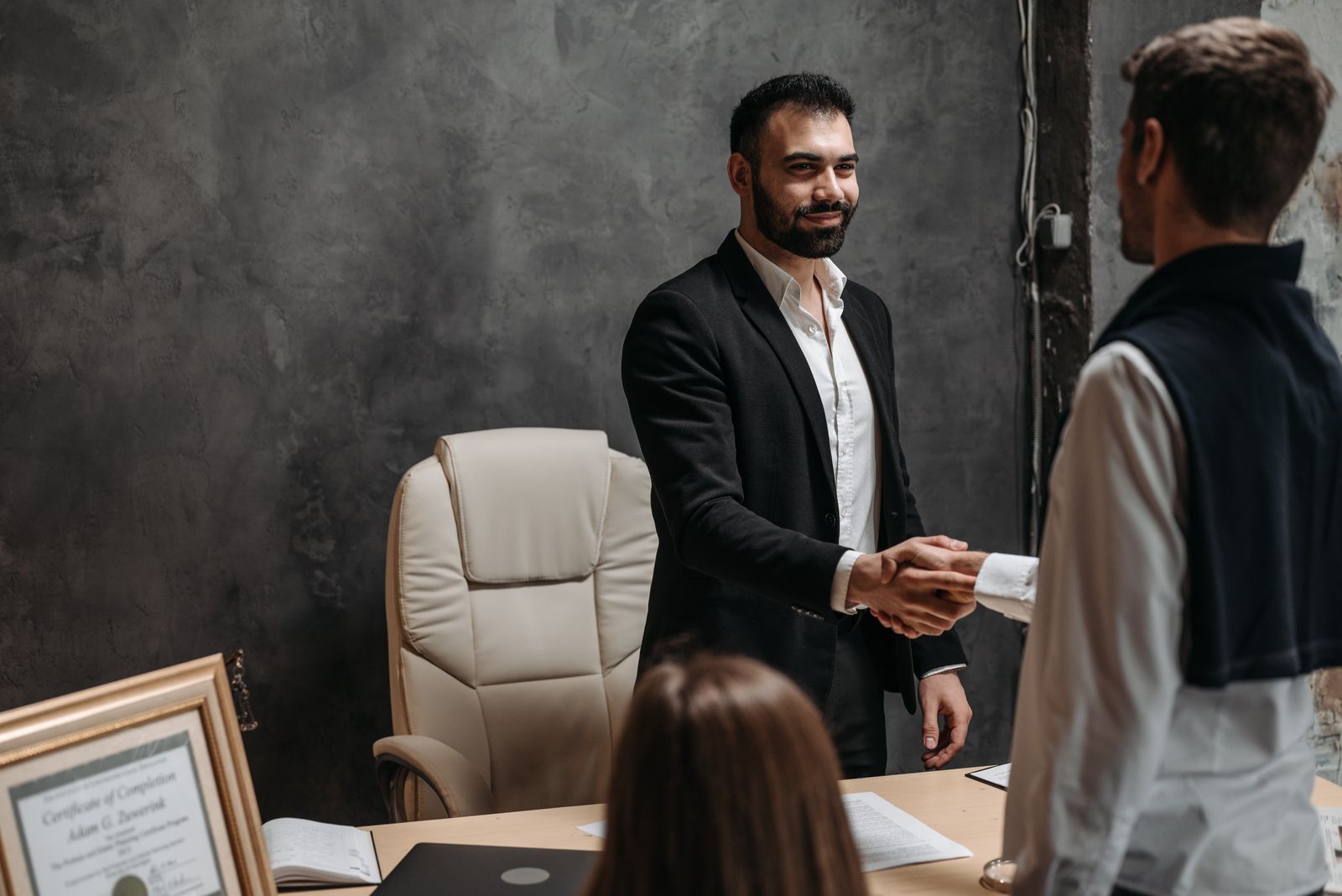 A loan officer meeting with clients at the Midtown office