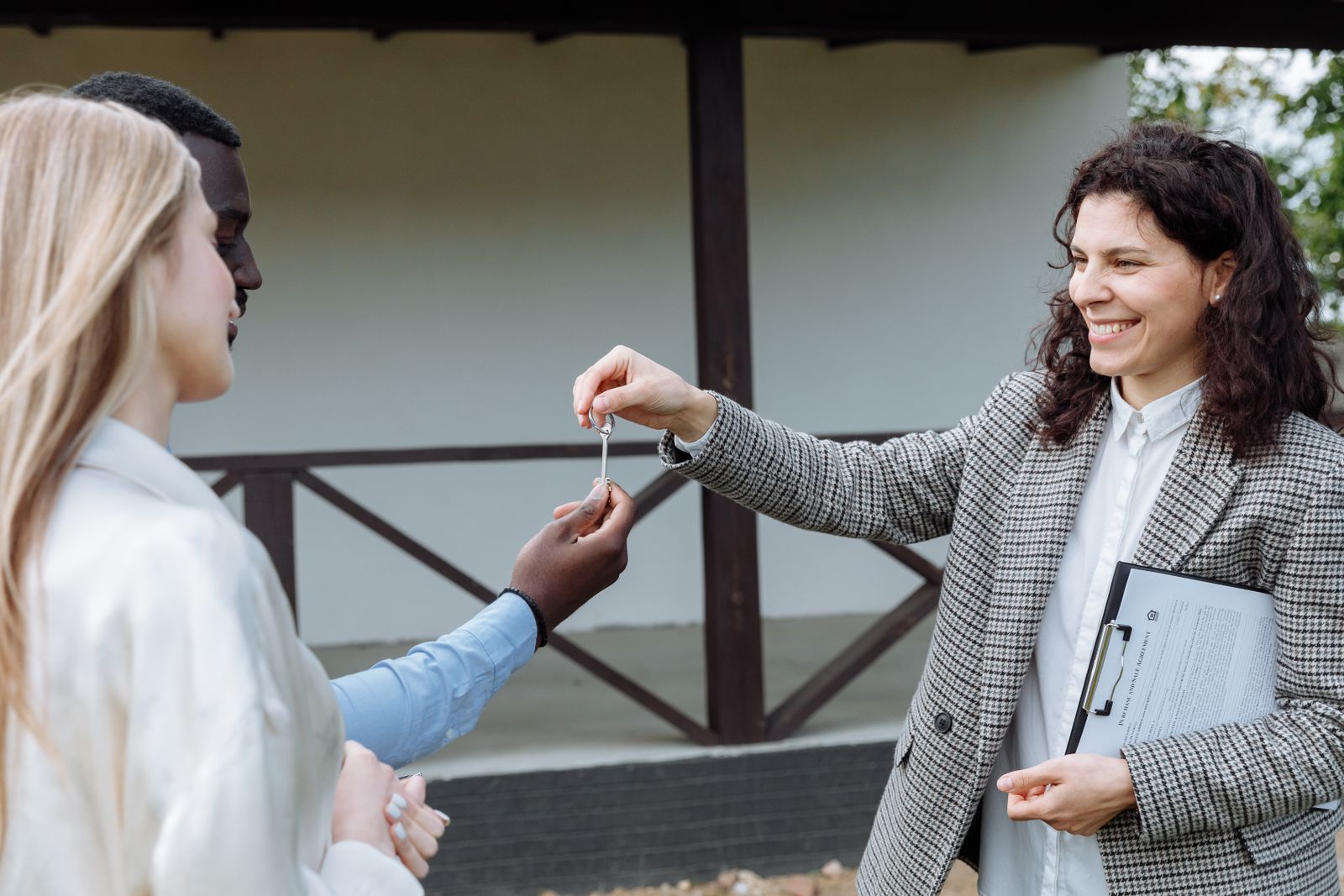 A couple holding the keys to their first home